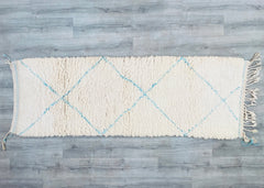 Transform your space with a genuine Moroccan Azilal rug, a masterpiece of Berber tribal art. These handwoven wool carpets boast vibrant geometric motifs and a luxuriously soft pile, blending rustic charm with contemporary elegance. Choose from classic Beni Ourain (white/black), blue diamond patterns, or custom-colored designs to match your decor. Available in multiple dimensions (3x5 ft, 6x9 ft, 8x10 ft), they’re ideal for cozy nurseries, minimalist offices, or bohemian lounges. The natural lanolin-rich woo