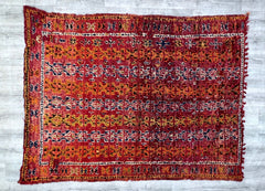 Step into the world of artisanal weaving with this breathtaking vintage Berber carpet. Each knot and weave tells a story of cultural heritage, featuring symbolic tribal patterns that have been passed down through generations. The plush wool construction offers unmatched softness underfoot, while the faded, earthy tones bring a relaxed, bohemian vibe to any space. Ideal for layering in living areas, dressing up a bedroom, or adding texture to a minimalist setting, this carpet is a versatile masterpiece. Its