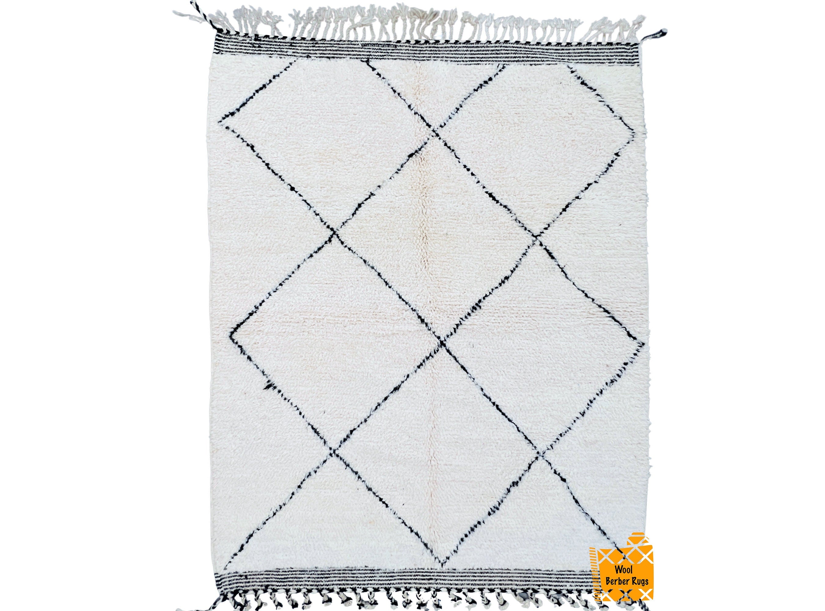 Enhance your home’s warmth and texture with this vintage Moroccan Berber rug. Handmade from pure wool, this rug features intricate tribal patterns in classic black and white, offering a perfect balance of rustic charm and contemporary style. Ideal for boho, mid-century modern, or minimalist interiors, this area rug adds depth and character to any room. The thick, plush pile provides comfort and insulation, making it great for high-traffic areas. Each rug tells a story through its unique imperfections, refle