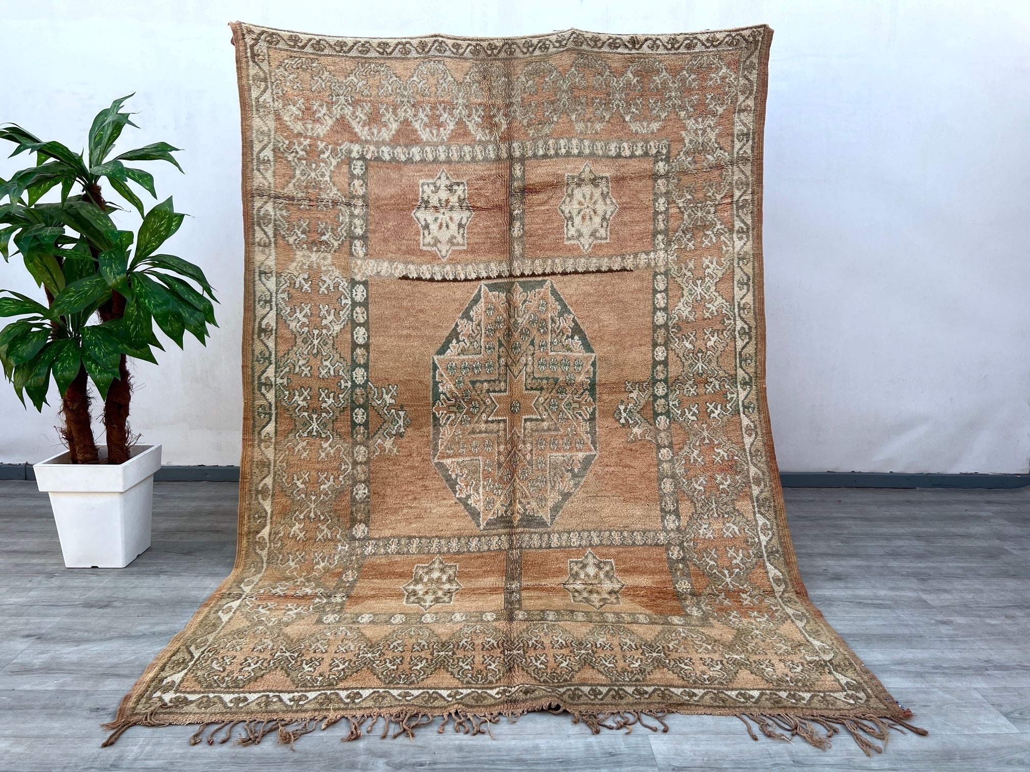 Bring a touch of exotic elegance to your home with a vintage Moroccan rug, featuring intricate tribal patterns and rich, faded hues. Handwoven by skilled artisans, these bohemian Berber rugs showcase traditional geometric designs, distressed textures, and luxurious wool craftsmanship. Perfect for adding warmth to living rooms, bedrooms, or hallways, each piece tells a story with its unique imperfections and earthy tones. Whether you prefer neutral Oushak runners, vintage Boujaad carpets, or Persian-inspired