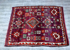 Enhance your space with this stunning vintage Moroccan Boujaad rug, a handwoven Berber wool carpet featuring rich, bohemian-inspired tribal patterns. Measuring 6x11 feet, this large area rug is perfect for living rooms, bedrooms, or hallway runners, adding warmth and authentic Moroccan charm. Crafted by skilled artisans using traditional weaving techniques, this vintage rug showcases a durable wool texture with vibrant colors and geometric designs. The Boujaad style is known for its bold motifs and cultural