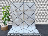 Discover the charm of a vintage Moroccan rug, featuring Beni Ourain, Azilal, and Boucherouite designs for a truly bohemian home decor statement. Each handmade Berber rug is woven from 100% natural wool, offering plush texture and tribal geometric patterns in neutral tones. Ideal for Scandinavian, boho-chic, or eclectic spaces, these Moroccan carpets add warmth and artistry to any room. Choose from small 4x6 rugs to large 8x10 statement pieces, or request a custom-sized Moroccan area rug. Perfect as a unique