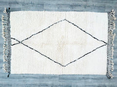 Discover the beauty of vintage Moroccan tribal rugs, meticulously handwoven by Berber artisans using premium wool. These carpets feature classic Beni Ourain, Azilal, and Marmoucha designs, blending timeless elegance with rustic charm. The neutral color palette and abstract patterns make them versatile for any décor style, from minimalist to bohemian. Whether used as a floor rug, wall hanging, or layered accent, these authentic pieces bring texture and cultural depth to your space. Each rug tells a story thr