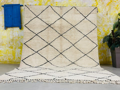 Enhance your home with a luxurious handmade Moroccan rug, featuring Beni Ourain, Azilal, and Berber designs in soft, high-quality wool. Our authentic Moroccan carpets are available in custom sizes and colors, making them perfect for living rooms, bedrooms, or office spaces. Choose from modern geometric patterns, vintage tribal motifs, or minimalist ivory rugs—all handwoven by Moroccan artisans. Whether you prefer a black and white diamond rug, a cozy shag carpet, or a boho-chic floor covering, our selection