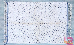 Beni Ourain rug, a stunning blue Moroccan piece that brings a touch of elegance to any space. Handcrafted by skilled artisans, this genuine wool rug showcases intricate Berber patterns, combining tradition with modern aesthetics. Soft and durable, it offers comfort underfoot while enhancing your home decor. Ideal for living rooms, bedrooms, or any area in need of a stylish accent, this handmade rug embodies the rich cultural heritage of Morocco. Elevate your interior with this exquisite piece today!
