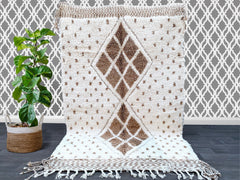 Discover the finest Beni Ouarain Berber rugs at woolberber.com—your trusted source for authentic Moroccan handwoven carpets. Each rug is crafted by skilled artisans using 100% natural wool, featuring the iconic geometric patterns and plush texture of traditional Beni Ouarain tribes. Perfect for modern and bohemian interiors, our rugs add warmth, texture, and cultural elegance to any space. Available in vintage and custom designs, these ethically sourced rugs support fair trade practices. Shop now for exclus