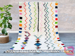 Elevate your home with this handmade Beni Ourain-style rug, inspired by the iconic tribal designs of Morocco. Woven from premium natural wool, this vintage Berber rug features a plush texture and minimalist geometric motifs, perfect for adding warmth to any room. The neutral tones complement both contemporary and traditional interiors, making it a versatile choice for living rooms, dining areas, or bedrooms. Each rug is one-of-a-kind, showcasing the artisan’s craftsmanship and cultural heritage. Durable, co