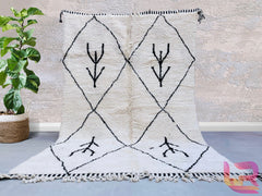 Discover the beauty of authentic Beni Ourain rugs, handwoven by skilled artisans using premium sheep wool. These Moroccan Berber rugs feature striking black and white geometric patterns, adding a minimalist yet luxurious touch to any space. Each piece is hand-knotted, ensuring durability and a unique texture. Perfect for modern, bohemian, or Scandinavian interiors, these rugs bring warmth and cultural heritage into your home. Whether you prefer a vintage tribal design or a contemporary abstract pattern, the