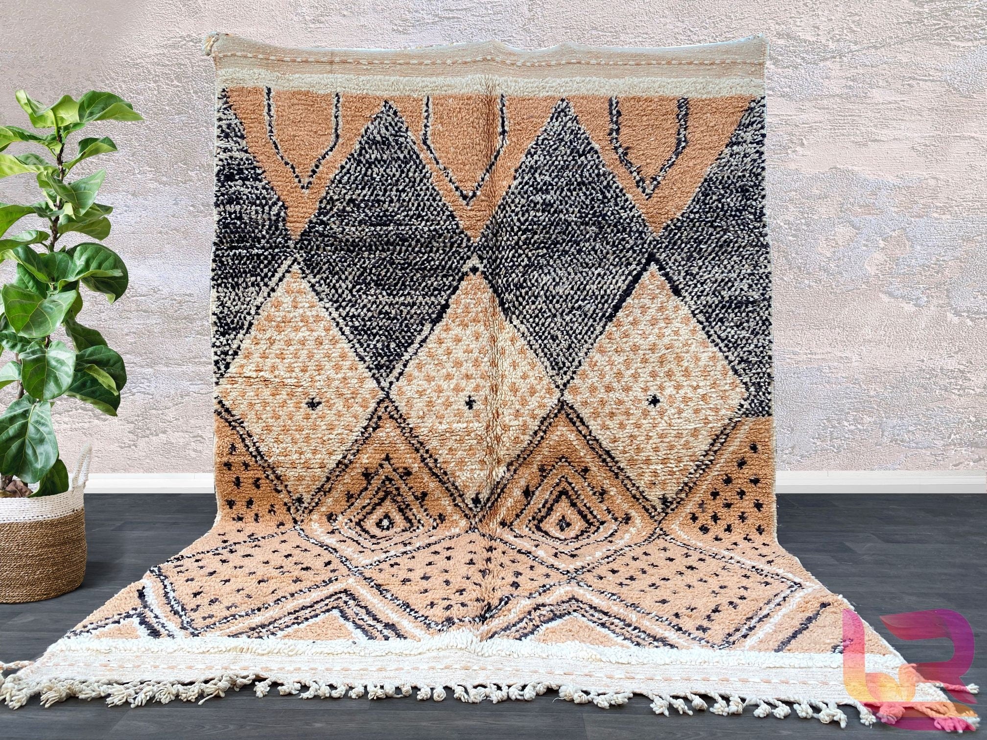 Bring timeless elegance to your home with this authentic handmade Moroccan Beni Ourain rug, crafted from genuine wool by skilled artisans. Featuring the iconic tribal geometric patterns of the Berber tradition, this soft, plush rug adds warmth and texture to any space. Perfect for living rooms, bedrooms, or boho-inspired interiors, this hand-knotted area rug combines durability with a naturally distressed, vintage look. The neutral tones blend seamlessly with modern and traditional decor, making it a versat