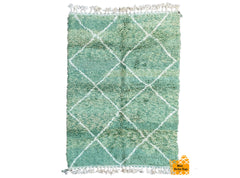 Bring timeless elegance to your space with this authentic handwoven Moroccan green wool rug, crafted in the traditional Berber style. Featuring a rich green hue and intricate geometric patterns, this rug is made from 100% natural wool, offering both durability and a plush, soft texture underfoot. Each piece is meticulously handcrafted by skilled artisans, ensuring a unique and high-quality addition to your home. Perfect for living rooms, bedrooms, or dining areas, this rug adds warmth and cultural charm to 