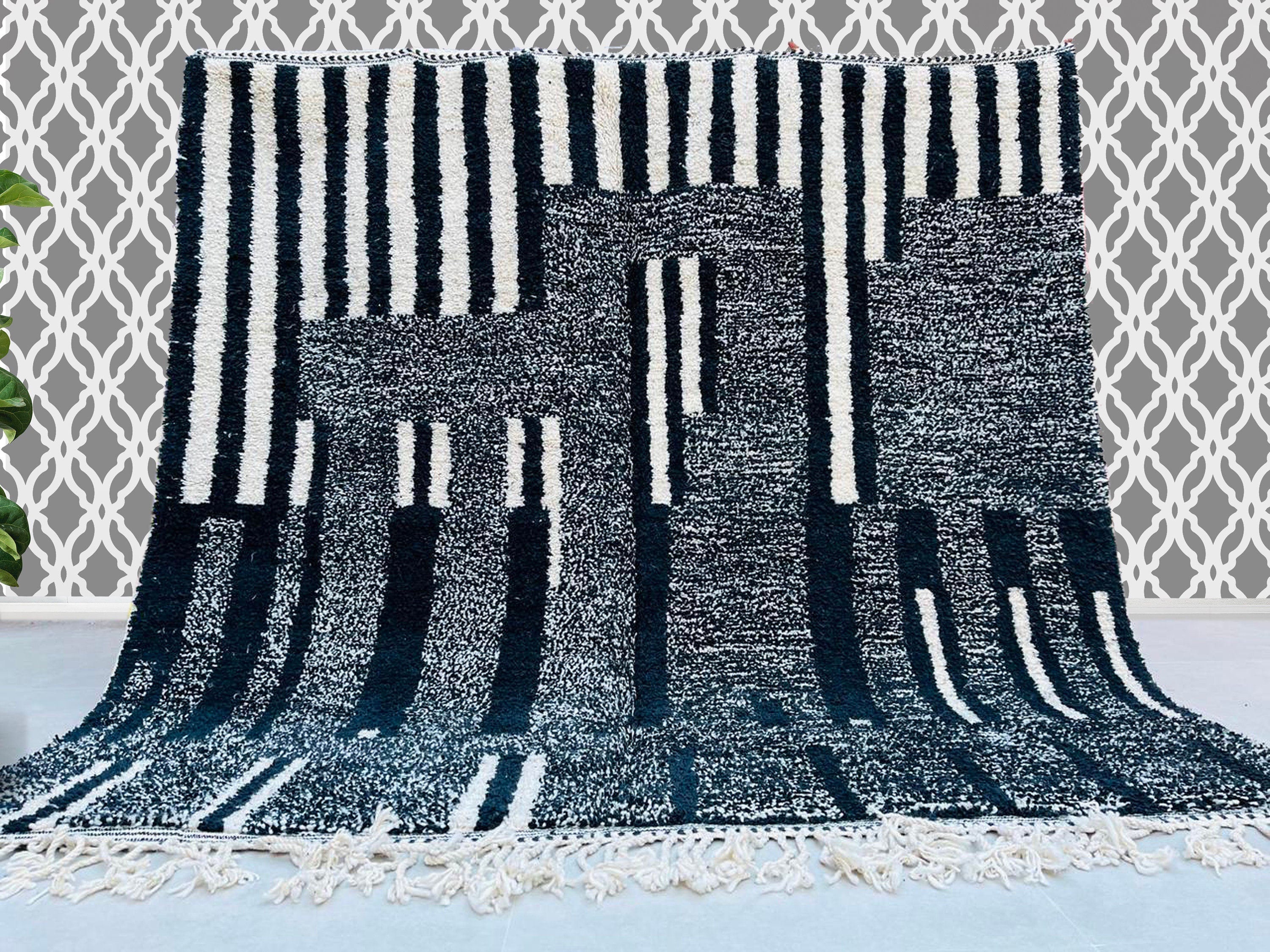 Discover the timeless beauty of authentic Moroccan Berber rugs, handwoven by skilled artisans using genuine wool for durability and softness. Our collection features custom Moroccan rugs, including Beni Ourain, Azilal, and minimalist designs, perfect for adding a touch of tribal elegance to any space. Each handmade rug showcases unique geometric patterns in black and white, neutral tones, or vibrant colors, making them ideal area rugs for living rooms, bedrooms, or offices. Whether you prefer a traditional 
