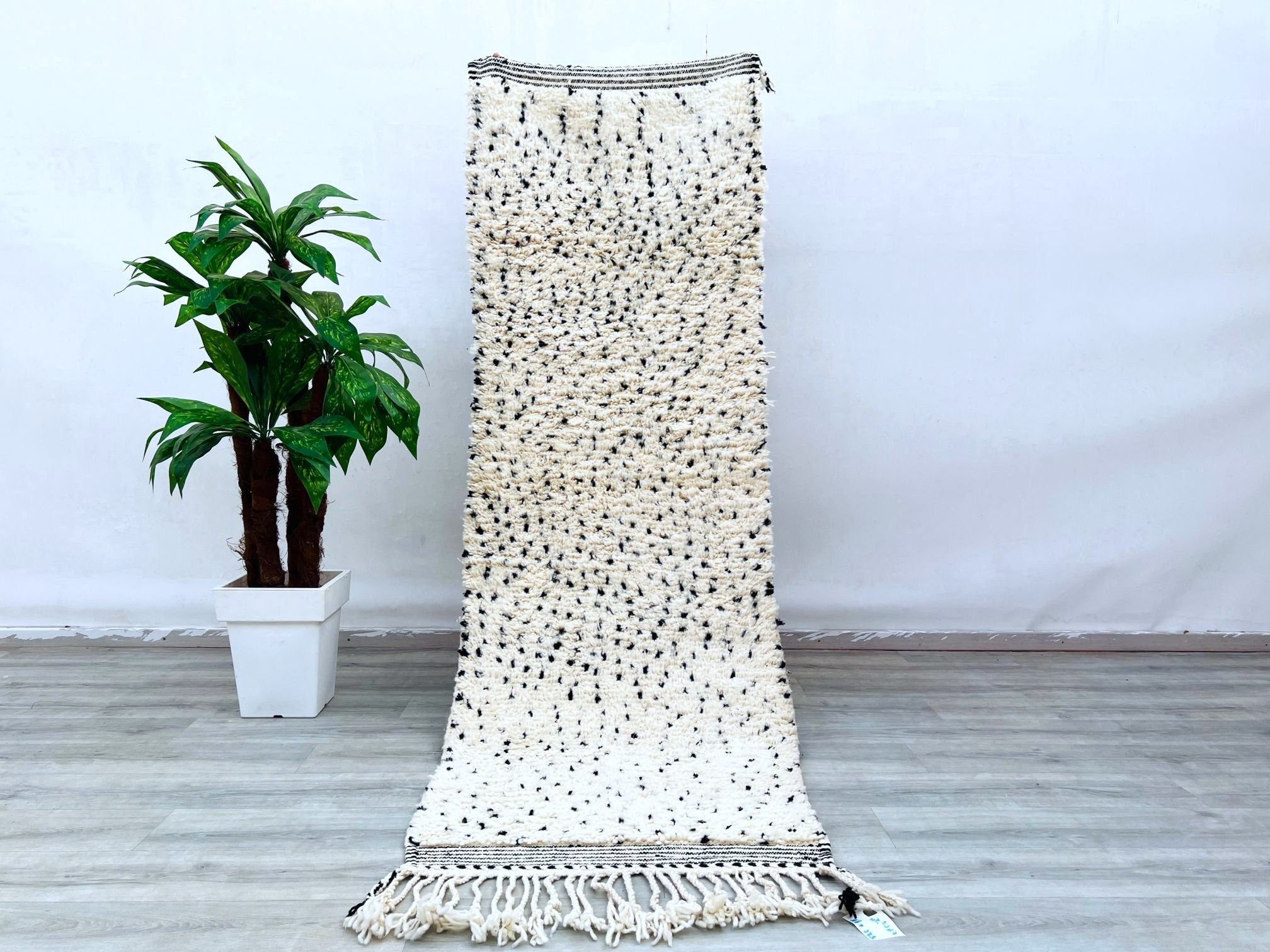 Add a touch of Moroccan charm to your space with this vintage Kilim Rug. Large enough to be used as an Rug, it offers both comfort and style. Handwoven from high-quality wool, its intricate patterns and rich colors make it a perfect addition to living rooms, patios, or any cozy corner. Cover only for a customizable look.