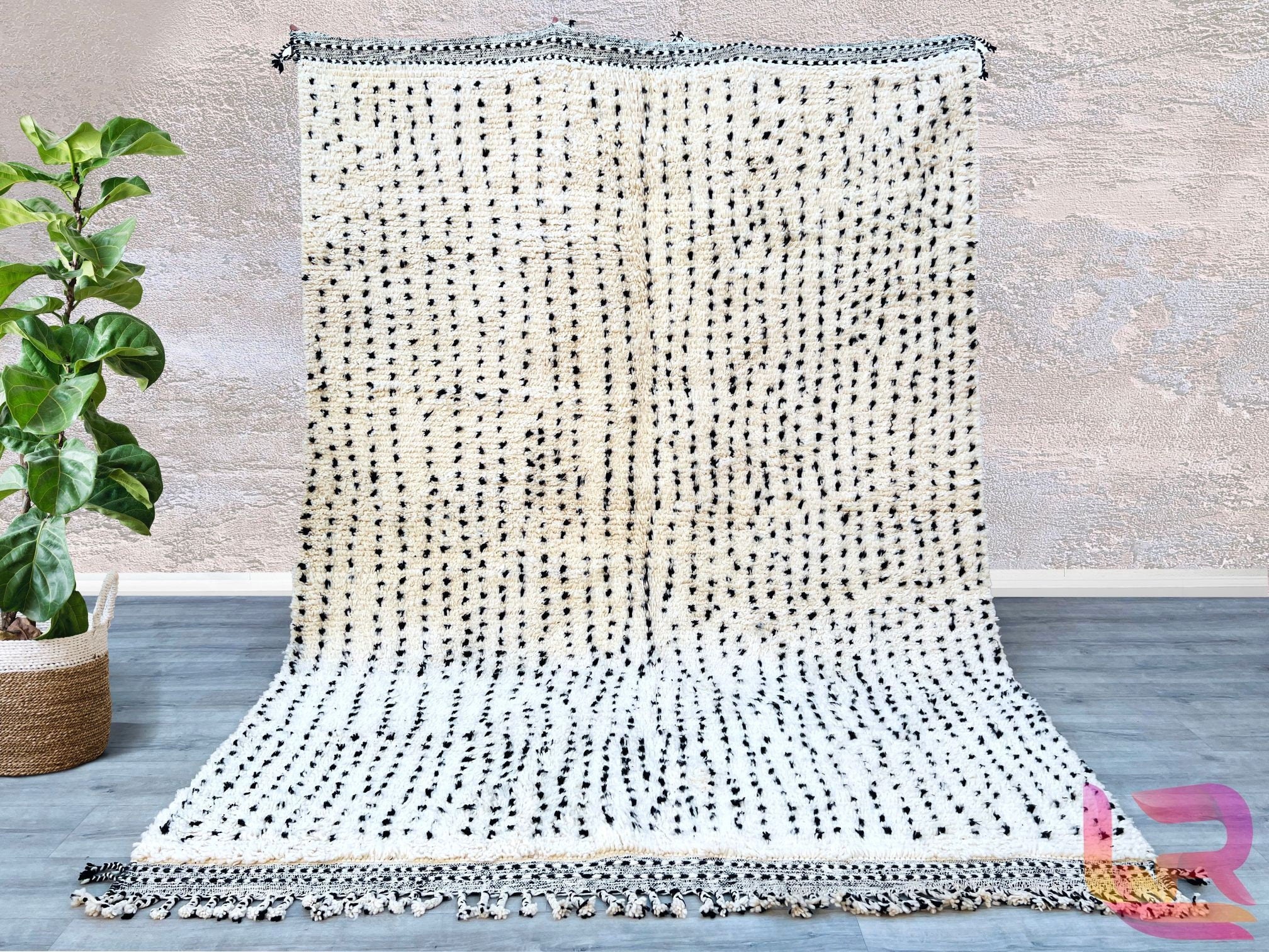 Boujad Moroccan Rug, meticulously handmade by skilled Berber artisans from the Atlas Mountains. This exquisite piece features unique abstract designs that reflect the rich cultural heritage of Morocco, adding a touch of vibrancy to any room. Crafted from the finest quality wool, each rug is individually spun, dyed using natural products, and woven entirely by hand—ensuring that no machines are involved in the process. Once complete, the rug is trimmed, washed, and sun-dried in the mountain air, resulting in