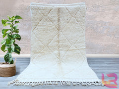 Elevate your home décor with a stunning Moroccan Berber rug, handwoven by artisans using traditional techniques. These rugs showcase intricate tribal patterns and a plush wool texture, offering both style and comfort. The neutral tones and geometric designs effortlessly complement boho, Scandinavian, or contemporary interiors. Each rug is sustainably crafted, ensuring a unique, eco-friendly addition to your space. Whether used as a statement piece in the living room or a cozy accent in the bedroom, these ru