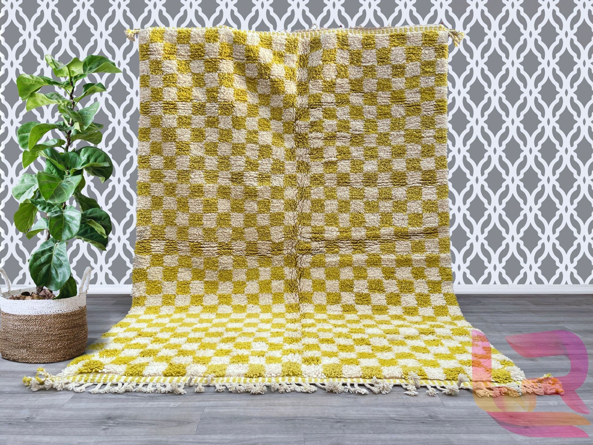 Add a touch of Moroccan artistry to your space with this custom checkered Berber rug, meticulously handwoven using 100% natural wool. The bold checkerboard pattern in yellow and white creates a striking visual contrast, perfect for modern and traditional interiors alike. Designed for both style and comfort, this Beni Ourain-inspired rug features a soft, dense pile that feels luxurious underfoot. Each piece is one-of-a-kind, reflecting the artisan’s skill and heritage. Whether used as a statement floor piece