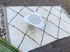 Transform your home with a custom Moroccan Berber rug, hand-knotted by artisans using premium wool for unmatched softness. Our Beni Ourain, Azilal, and Boujad rugs showcase vintage tribal motifs, blending seamlessly into modern, boho, or rustic interiors. Whether you need a cozy 3x5 ft accent rug or a large 6x9 ft living room centerpiece, these handmade Moroccan carpets offer durability and timeless elegance. Pair with Boucherouite or vintage Oriental rugs for a layered look. Ethically sourced and fair trad