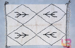 Bring a piece of Moroccan heritage into your home with customizable Beni Ourain and Azilal rugs. These hand-knotted wool rugs feature bold tribal patterns, from abstract shapes to symmetrical diamonds, all crafted using age-old weaving techniques. The soft, high-pile texture adds comfort, while the neutral black and white palette complements any décor style. Whether you seek a minimalist modern rug or a vintage-inspired tribal piece, these fair trade handmade carpets offer unmatched quality and cultural aut