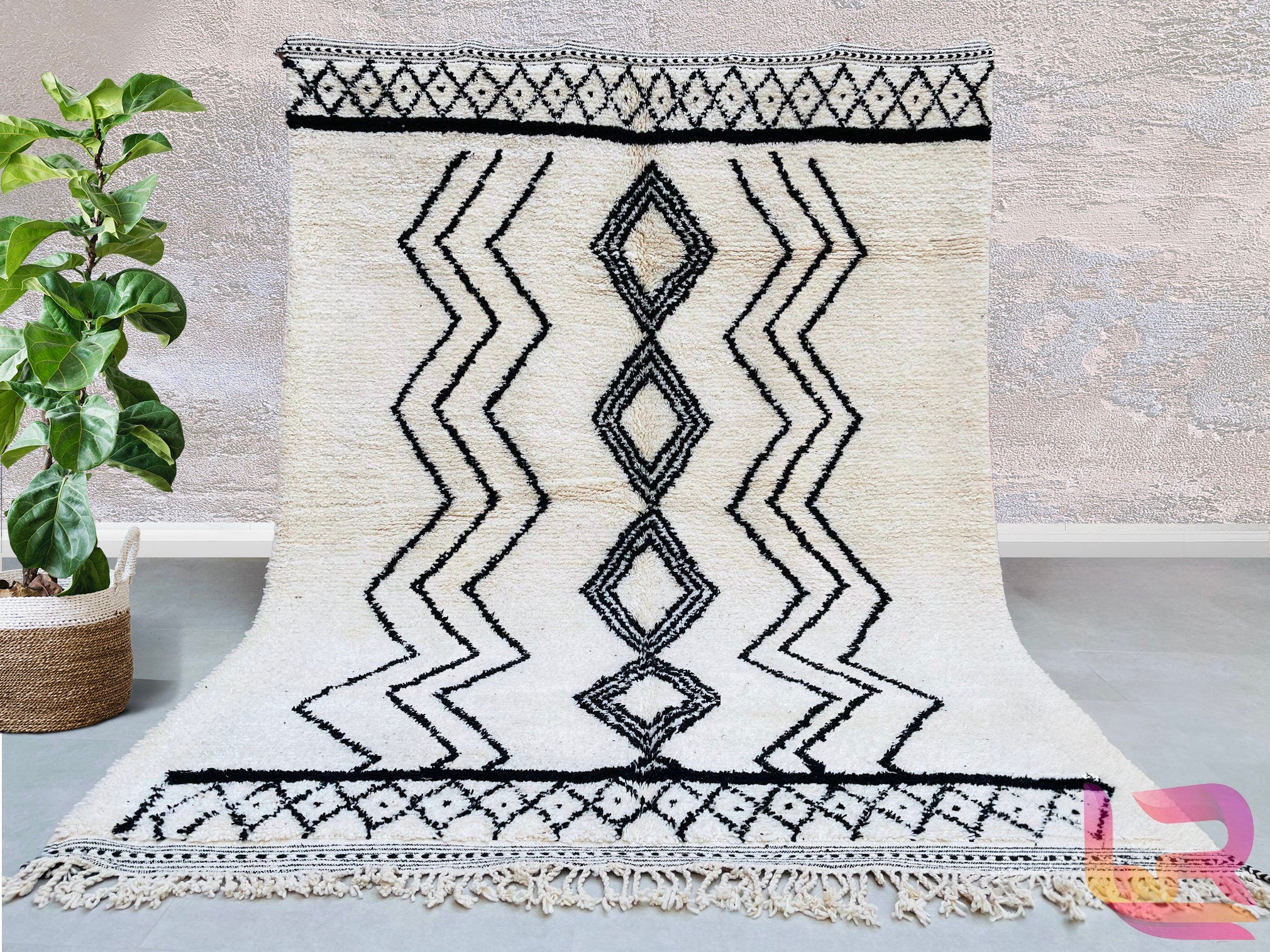 Elevate your home with a handmade Moroccan Beni Ourain rug, crafted from natural wool by skilled Berber artisans. This authentic tribal rug features a soft, plush texture and a timeless black-and-white geometric design, perfect for modern and boho interiors. Each custom Moroccan carpet is hand-knotted, ensuring durability and unique artistry. Whether used as a living room centerpiece or a bedroom accent, this wool Berber rug adds warmth and elegance. Free shipping available for a seamless shopping experienc