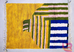 Bring the rich heritage of Moroccan craftsmanship into your home with this handmade Berber rug. Expertly hand-knotted by skilled artisans, this bohemian Beni Ourain rug features a stunning geometric design in natural wool, offering both durability and timeless elegance. The soft, high-pile texture adds warmth to any space, making it perfect for living rooms, bedrooms, or cozy reading nooks. Each rug is unique, showcasing traditional patterns passed down through generations. Whether you love boho, mid-centur