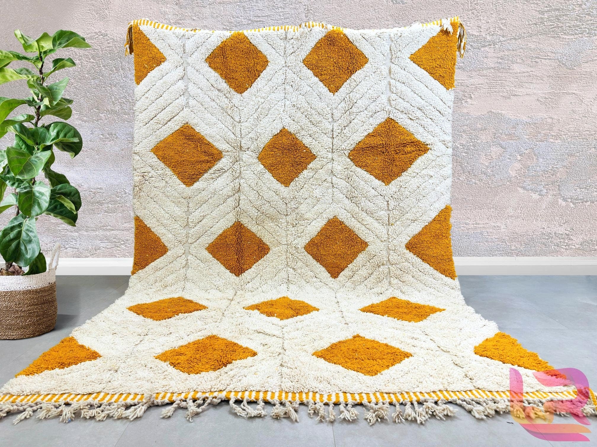 Elevate your home decor with this handmade Moroccan Berber rug, crafted from 100% Atlas Mountain wool for unmatched softness and durability. Each rug features authentic tribal designs, blending boho charm with mid-century elegance. Whether you prefer a vintage Beni Ourain pattern or a modern geometric style, this rug is fully customizable in size and color. Perfect for living rooms, bedrooms, or cozy reading nooks, it adds warmth and texture to any space. Enjoy free worldwide shipping and a luxurious, plush