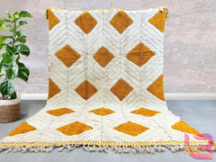 Elevate your home decor with this handmade Moroccan Berber rug, crafted from 100% Atlas Mountain wool for unmatched softness and durability. Each rug features authentic tribal designs, blending boho charm with mid-century elegance. Whether you prefer a vintage Beni Ourain pattern or a modern geometric style, this rug is fully customizable in size and color. Perfect for living rooms, bedrooms, or cozy reading nooks, it adds warmth and texture to any space. Enjoy free worldwide shipping and a luxurious, plush
