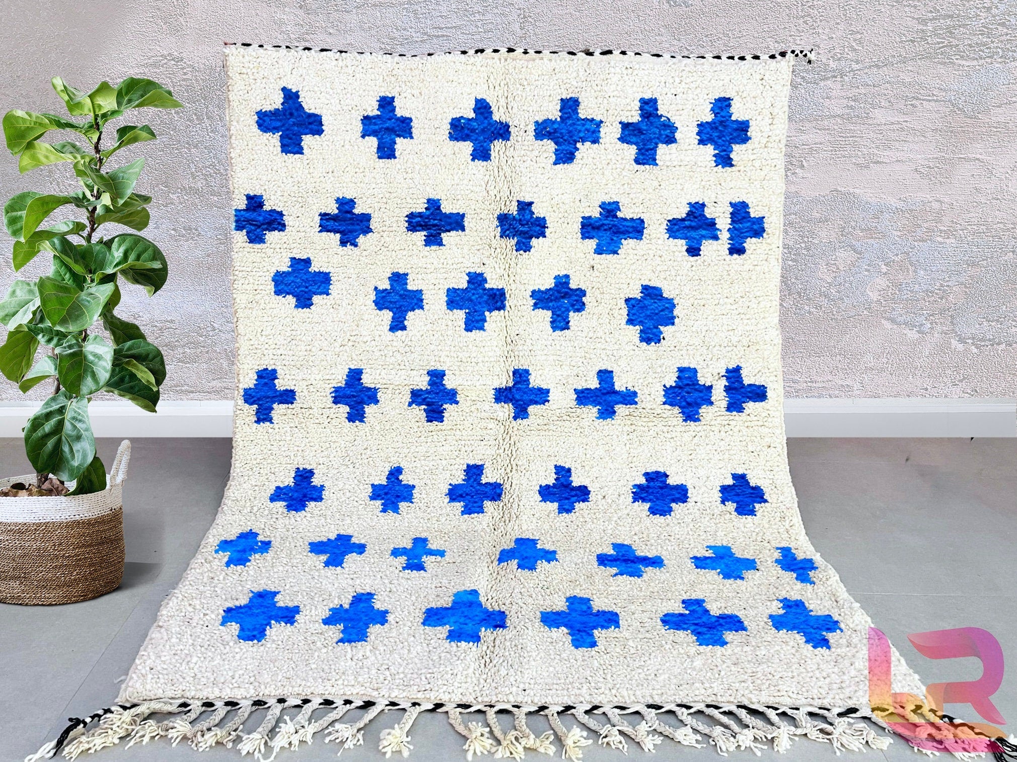 Discover the beauty of handmade Moroccan wool rugs from The Anou Cooperative, featuring fair trade craftsmanship. Our blue and white Berber rugs are pet-friendly, durable, and perfect for bedrooms, living rooms, or hallways. Available in custom sizes (8x10 ft, 6x9 ft, etc.), these Beni Ourain-style rugs blend traditional weaving techniques with modern boho aesthetics. Whether you prefer checkered patterns, abstract designs, or Azilal-inspired motifs, each rug is handwoven by Moroccan artisans. Shop on Etsy,