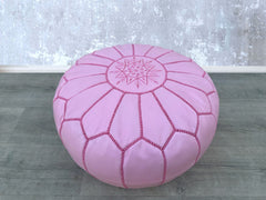 Discover high-quality leather ottomans that blend sophistication and practicality. From genuine leather storage ottomans with lift-top designs to tufted leather benches, our collection offers versatile seating and hidden storage. Ideal for living rooms, bedrooms, or entryways, these leather footstools come in mid-century modern, Moroccan, and contemporary styles. Choose between square, round, or cube leather poufs in tan, black, or brown. Handcrafted for durability, these leather coffee table ottomans also 