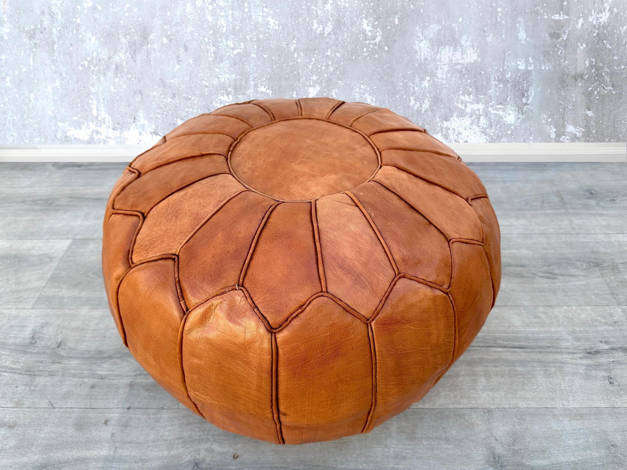 Upgrade your décor with sleek leather poufs and ottomans, designed for style and comfort. Whether you need a leather storage ottoman for blankets or a minimalist leather cube pouf, our selection includes top-grain leather, faux leather, and bonded leather options. Perfect as a coffee table alternative, footrest, or accent piece, these leather ottomans come in round, square, and rectangular shapes. Explore trendy colors like camel, espresso, and cream to match your interior. Durable, easy to clean, and space