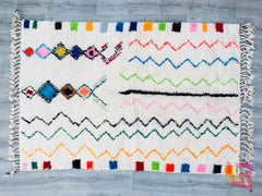 Bring authentic Moroccan charm into your home with this exquisite vintage Azilal rug, handwoven by skilled Berber artisans. Featuring intricate geometric patterns and a soft, neutral color palette, this 5x8ft wool rug adds warmth and texture to any space. The traditional Berber designs tell a story of heritage, making it a unique centerpiece for living rooms, bedrooms, or boho-inspired interiors. Crafted from natural wool, this rug is durable, cozy, and full of character. Whether layered over hardwood floor