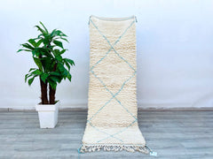Discover the timeless beauty of Moroccan Berber rugs, crafted by indigenous weavers using centuries-old methods. These handmade wool carpets feature Beni Ourain’s iconic trellis and diamond patterns in neutral tones (ivory, beige, blue) for versatile styling. Ideal for boho, Scandinavian, or eclectic interiors, the rugs come in custom sizes (2x7 ft, 4x7 ft, 5x9 ft) to fit any room. The plush, high-pile texture offers unmatched comfort underfoot, while the organic wool fibers ensure durability and insulation