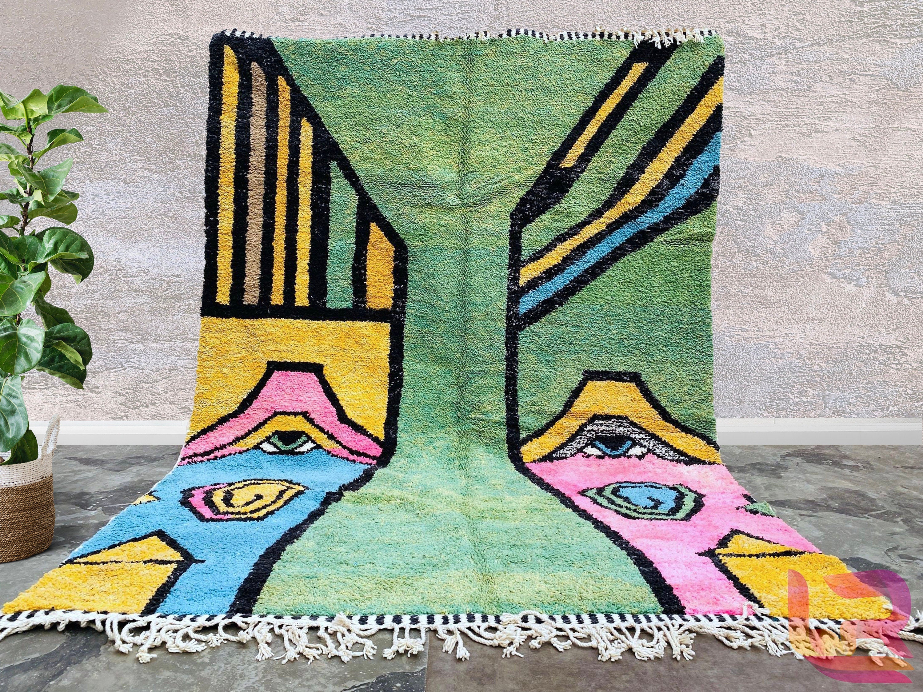 Add a vibrant touch to your decor with this vintage-inspired Moroccan Boujaad rug, handwoven using traditional techniques. The rich, faded hues and intricate patchwork design create a one-of-a-kind statement piece, blending rustic charm with artistic flair. Made from premium wool, this rug is both durable and soft, ideal for high-traffic areas. Its eclectic mix of colors—soft pinks, deep purples, and warm neutrals—enhances any room, from bohemian lounges to modern minimalist spaces. A perfect choice for tho