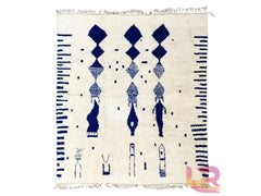 Discover the beauty of a vintage Azilal Moroccan rug, handwoven with intricate blue and white tribal motifs. Each piece tells a story through its abstract patterns and natural wool textures, reflecting generations of Berber weaving traditions. The soft, durable wool provides warmth and comfort, making it perfect for high-traffic areas like living rooms and hallways. Whether you love boho, mid-century, or minimalist décor, this rug adds a touch of global elegance to your space. Fully customizable in size and