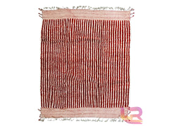 Bring a touch of global charm to your home with this vintage-inspired Moroccan rug. Handwoven by Berber artisans, this wool rug showcases traditional tribal patterns in a soothing blend of peach, ivory, and red tones. The durable, hand-knotted construction ensures long-lasting quality, while the high-pile texture adds a luxurious feel. Perfect for mid-century, bohemian, or eclectic interiors, this custom area rug effortlessly enhances living rooms, hallways, or reading nooks. A true statement piece that com
