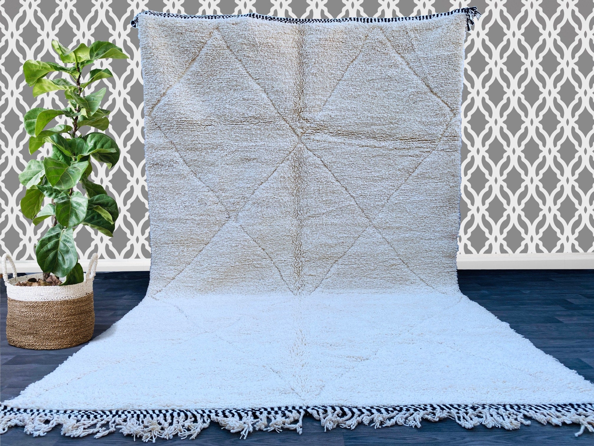 Enhance your home with a vintage Moroccan Berber rug, a true masterpiece of traditional craftsmanship. Made from premium undyed wool, this handwoven carpet showcases intricate tribal patterns and a soft, textured feel, perfect for boho-chic or Scandinavian decor. Each piece tells a story through its unique geometric motifs, reflecting the rich cultural heritage of the Atlas Mountains. Whether used as a statement floor piece or a wall hanging, this eco-friendly, naturally dyed rug adds warmth, texture, and a