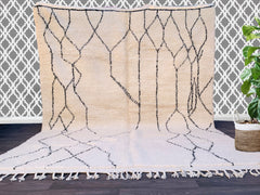 Discover the beauty of a handcrafted vintage Beni Ourain rug, a 100% wool Moroccan carpet that blends traditional Berber artistry with modern boho aesthetics. Each unique piece is handwoven in Morocco, featuring plush, high-pile wool for unmatched comfort underfoot. Ideal for living rooms, bedrooms, or nurseries, this Moroccan area rug comes in custom dimensions to fit any decor style—from Scandinavian minimalism to eclectic bohemian. Check out Etsy, MusMus Rugs, or Les Nomades De Marrakech for authentic, e