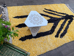 Enhance your space with this authentic handmade Moroccan Berber rug, crafted from natural wool in a stunning yellow hue. This vintage Azilal rug features tribal geometric patterns, reflecting the rich heritage of Moroccan craftsmanship. Measuring 2x8 feet, this unique tribal rug adds warmth and character to any room. Perfect for bohemian, eclectic, or modern interiors, this Moroccan wool rug is durable, soft, and full of cultural charm. Each piece is one-of-a-kind, with slight variations that highlight its 