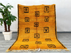 Elevate your space with this authentic handmade Moroccan Beni Ourain rug, crafted by Berber artisans using 100% natural wool. Measuring 5.9 ft x 7.5 ft, this bohemian-style rug features a soft, plush texture with traditional tribal patterns, perfect for adding warmth to living rooms, bedrooms, or cozy reading nooks. The neutral tones blend seamlessly with modern, rustic, or eclectic interiors. Each rug is unique, showcasing slight variations that highlight its artisanal heritage. Ideal for those who appreci