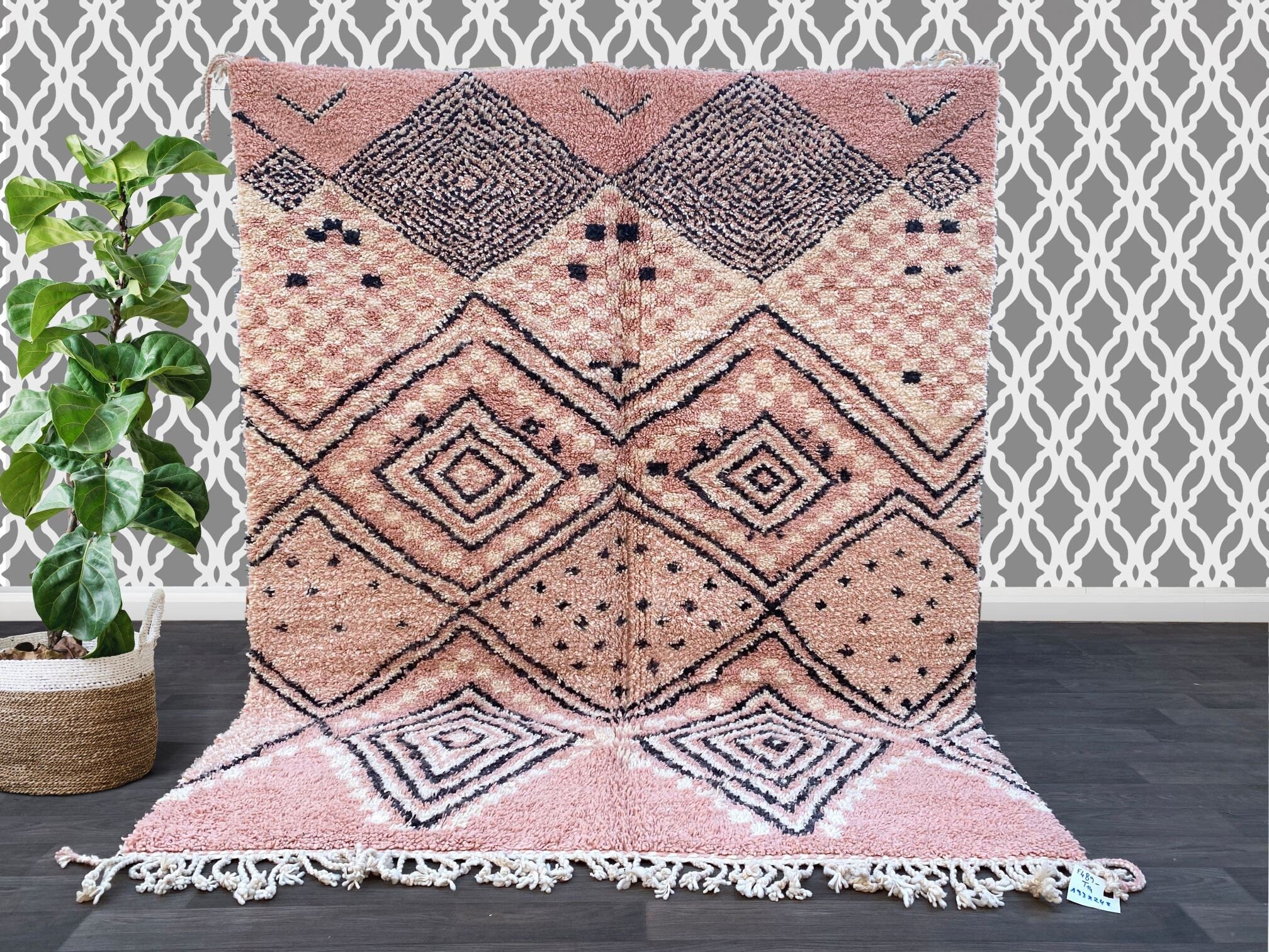 Enhance your home with a vintage Moroccan Boujad rug, a stunning handmade tribal carpet featuring rich, faded hues and traditional Berber symbols. These authentic wool rugs are woven by skilled artisans, showcasing unique patterns that tell a story of heritage and craftsmanship. The bohemian design blends seamlessly with mid-century, rustic, or contemporary interiors, adding warmth and character to any room. The distressed, time-worn look gives it a one-of-a-kind appeal, making each piece truly special. Per