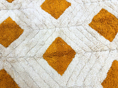 Discover the timeless appeal of a vintage Moroccan wool rug, meticulously handwoven by Berber artisans using traditional techniques. Made from ethically sourced Atlas Mountain wool, this rug features intricate diamond, checkered, or tribal motifs in warm neutrals or bold colors. Its durable, high-pile construction is perfect for living rooms, nurseries, or entryways. Custom sizing options ensure a perfect fit for any space, while the OEKO-TEX certified wool guarantees safety and sustainability. Pair it with