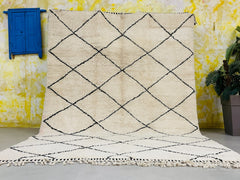 Enhance your home with a luxurious handmade Moroccan rug, featuring Beni Ourain, Azilal, and Berber designs in soft, high-quality wool. Our authentic Moroccan carpets are available in custom sizes and colors, making them perfect for living rooms, bedrooms, or office spaces. Choose from modern geometric patterns, vintage tribal motifs, or minimalist ivory rugs—all handwoven by Moroccan artisans. Whether you prefer a black and white diamond rug, a cozy shag carpet, or a boho-chic floor covering, our selection