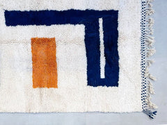 Beige Beni Ourain rug in Tuareg style, handmade from Moroccan wool; customizable sizes for any space.