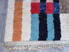 Bring artisan elegance into your home with a genuine Moroccan Berber rug, meticulously hand-knotted using organic wool. Our Beni Ourain carpets feature soft ivory backgrounds with bold black stripes, while colorful Azilal rugs offer playful Bohemian vibes. These handmade Moroccan rugs are versatile—drape them over sofas, use them as statement floor art, or layer them in eclectic spaces. Choose from vintage, distressed, or modern styles, all crafted by Berber tribeswomen using centuries-old techniques. Wheth